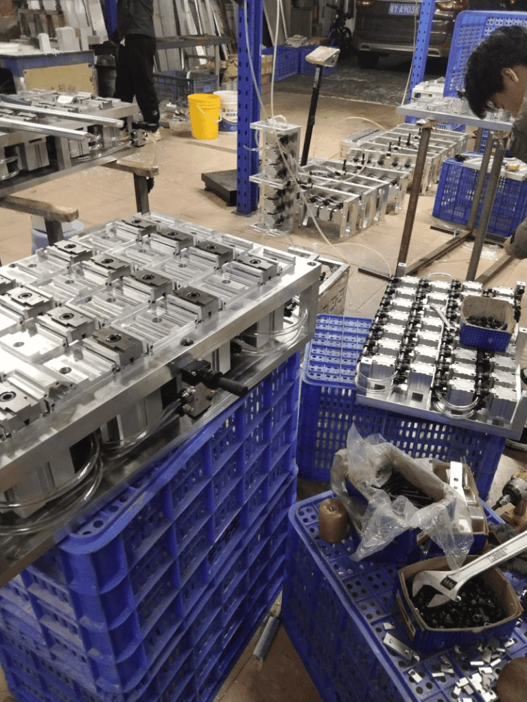 Precision CNC machined metal parts in a manufacturing workshop.