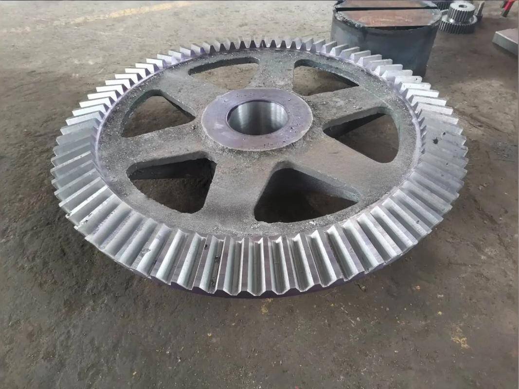 Machined metal gear wheel with external teeth and central bore