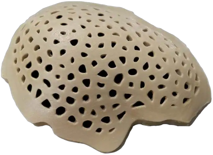 Precision CNC machined porous ceramic component with intricate hole pattern.