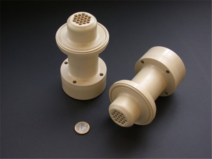 High-precision custom CNC plastic parts with intricate internal channels.