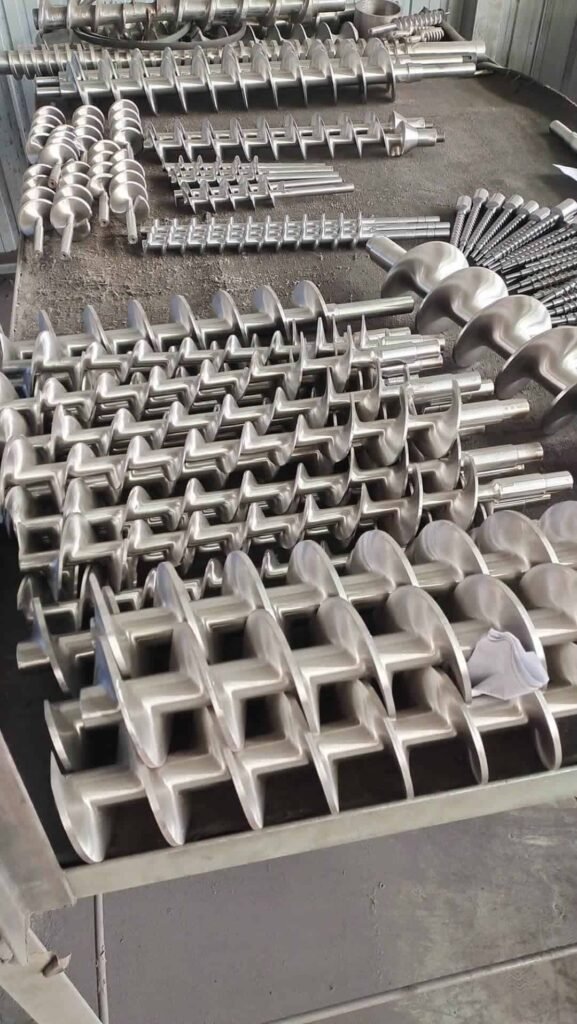 High-quality CNC machined metal components displayed on a workbench.