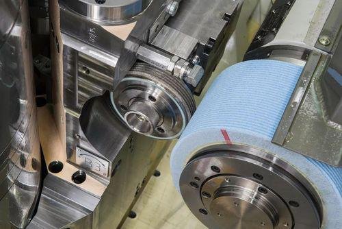 High-precision CNC machining process with metal components and machinery.