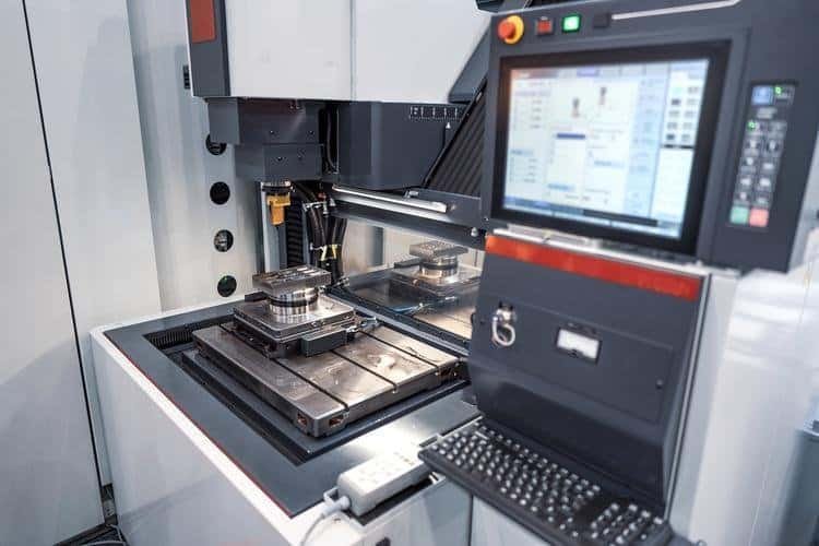 CNC machine performing precise manufacturing with computer control.