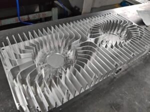 Aluminum CNC machined heat sink with fins for electronic cooling applications.