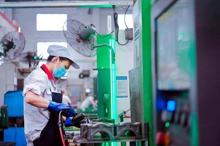 Workers are hand-polishing parts