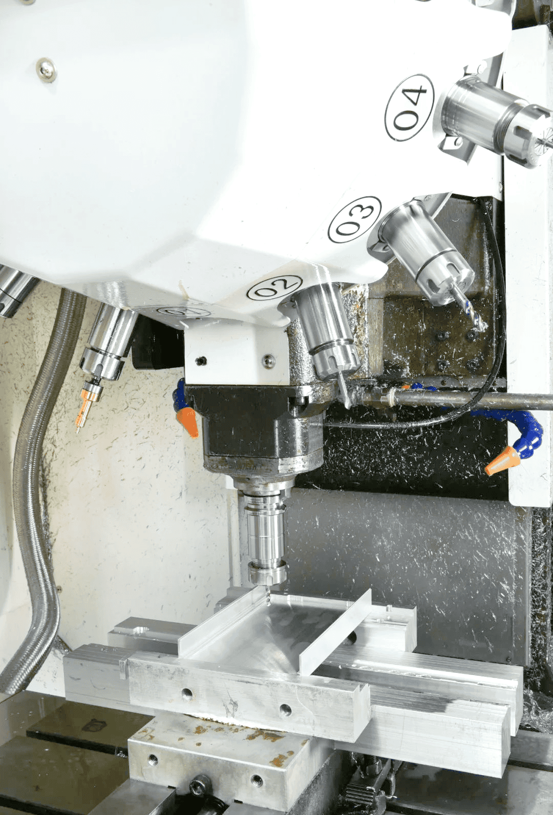 CNC equipment machining a supported housing
