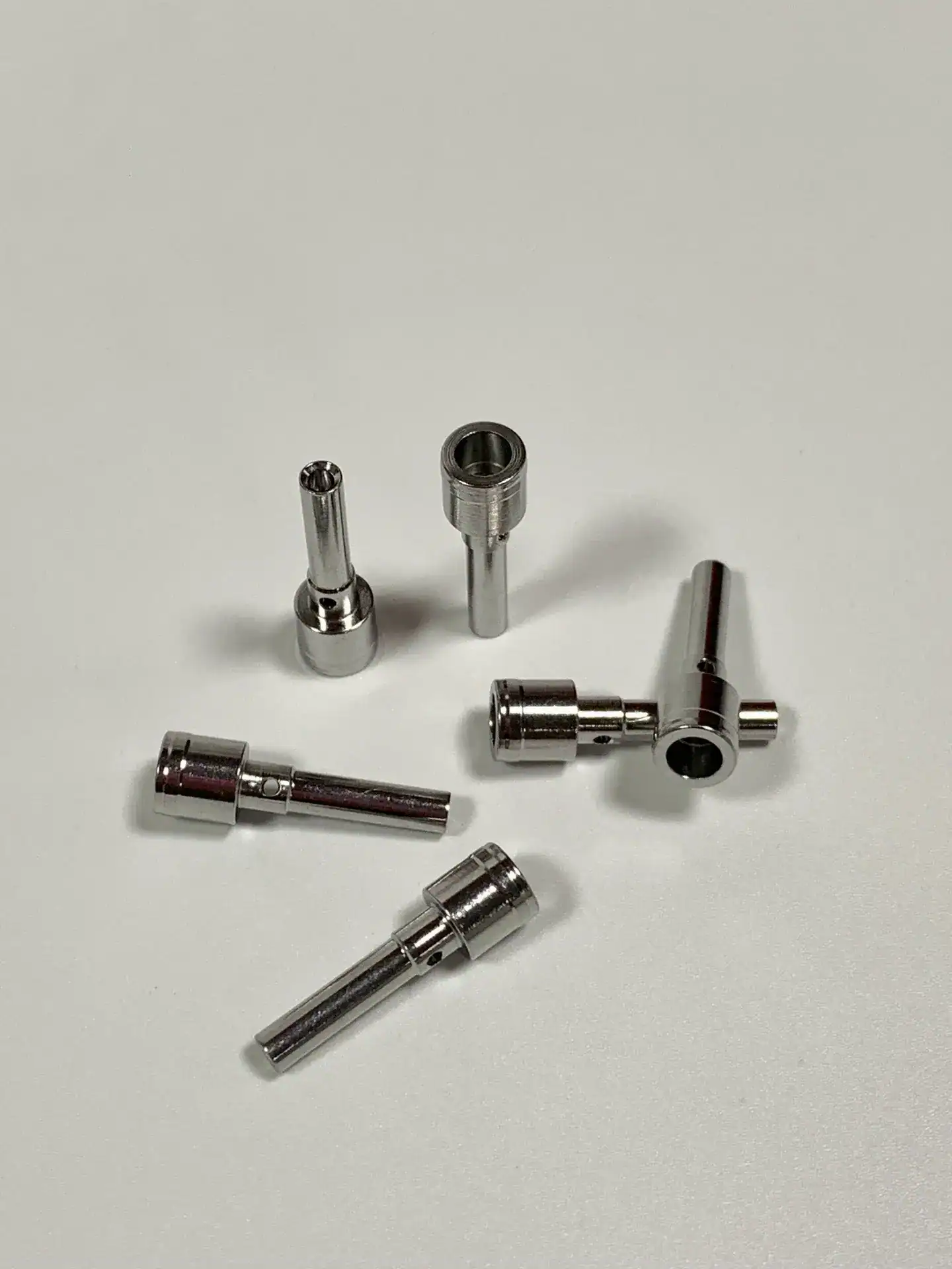 Cross-drilled miniature mill-turn components