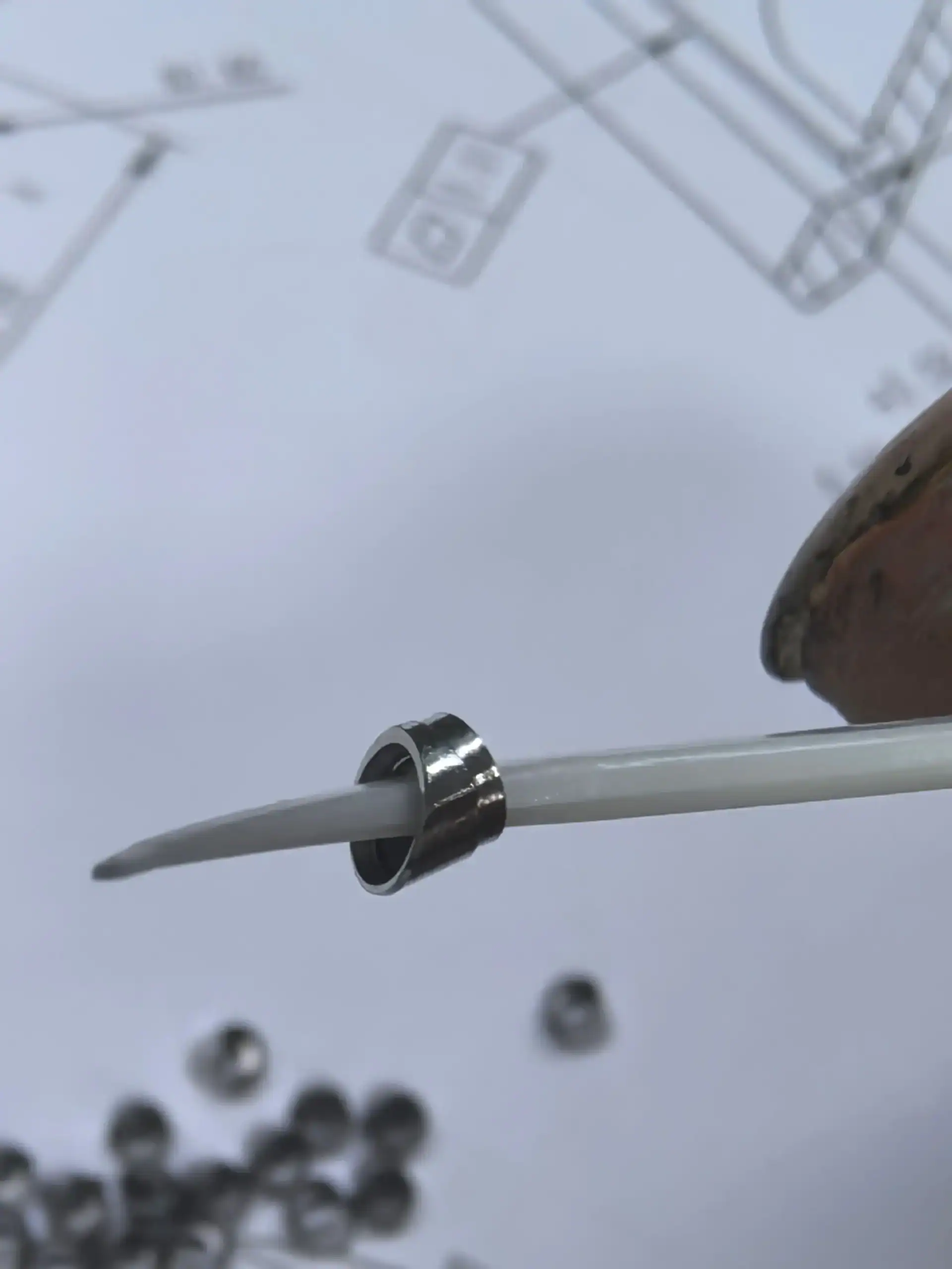 Handling a miniature machined ring