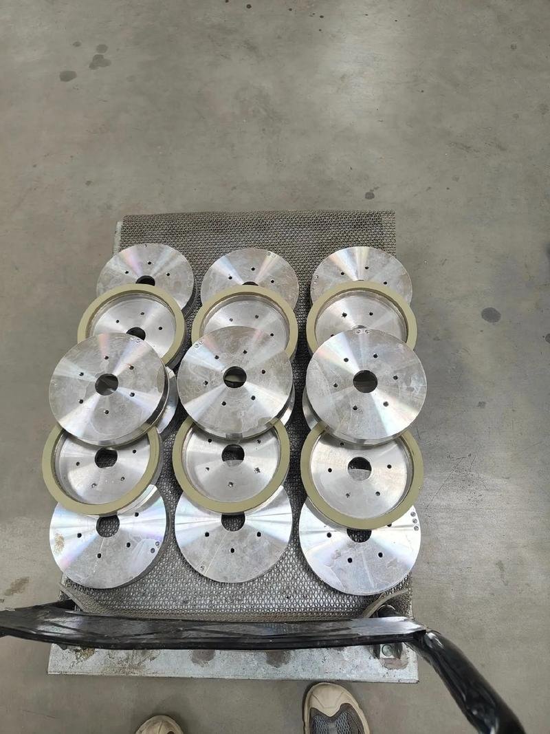 Batch of round metal components arranged on a trolley