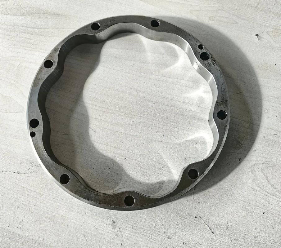 Metal ring with a shaped internal profile and mounting holes
