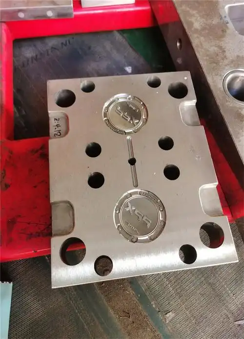 Metal tooling plate with multiple circular cavities and detailed internal features