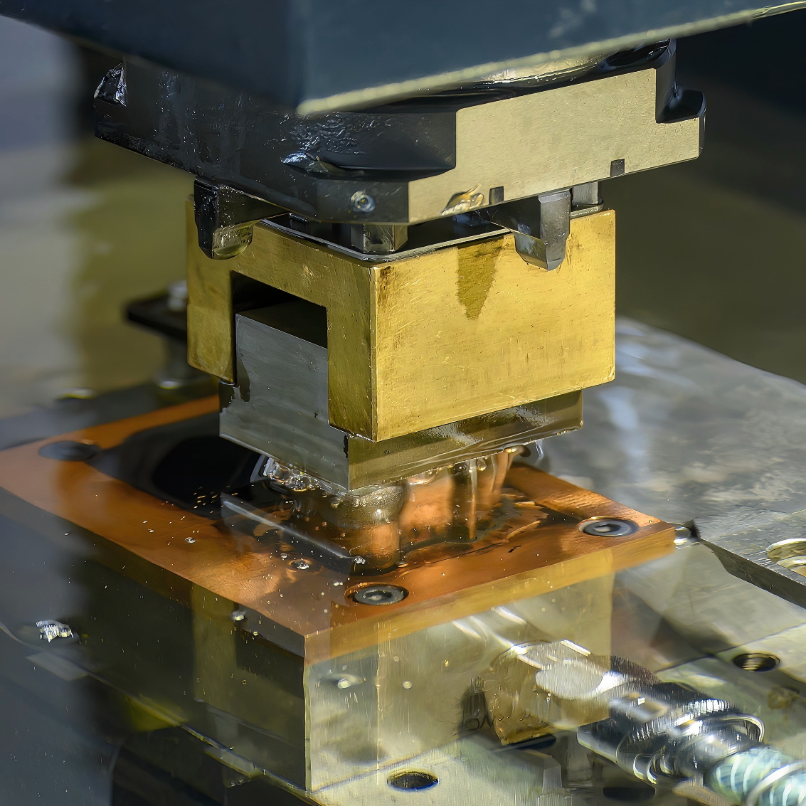 Square copper electrode producing a cavity in dielectric fluid