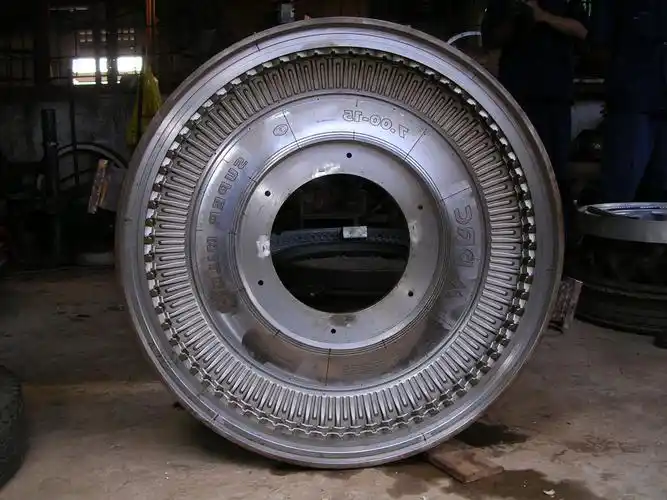 Large circular metal tooling component with repeated precision cavity features