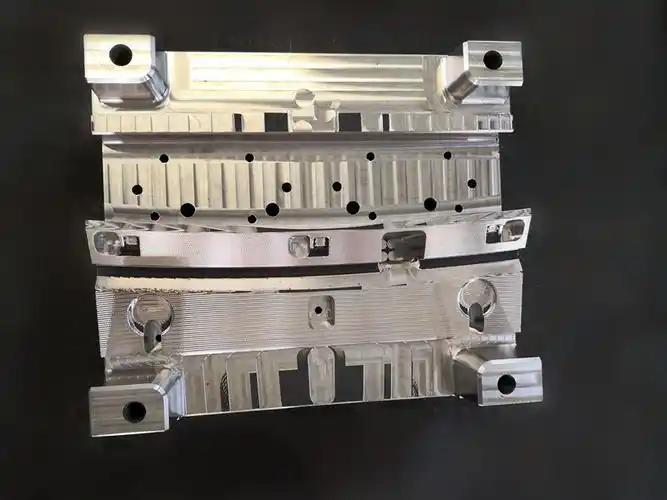 Precision metal mold assembly with detailed cavity and slide features