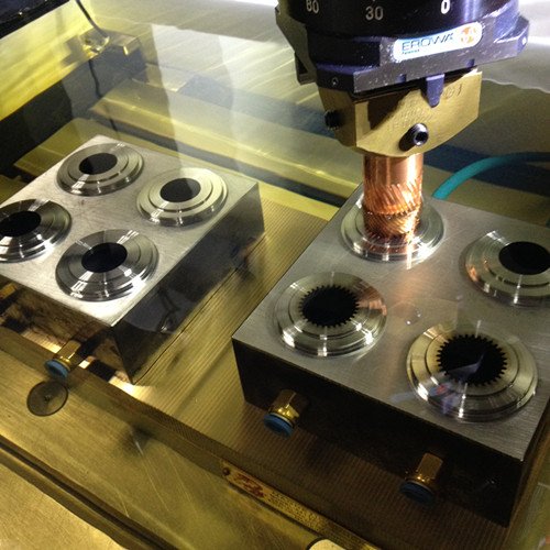 Copper electrode machining circular cavities in a metal mold insert