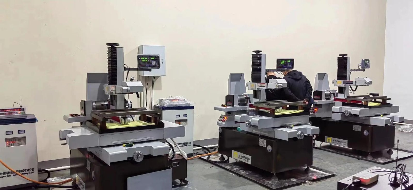 Multiple wire EDM machines in a precision machining workshop